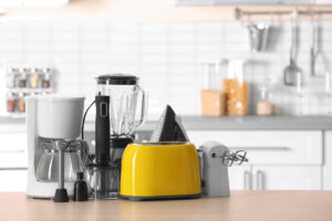 A selection of small kitchen appliances, including toasters and blenders